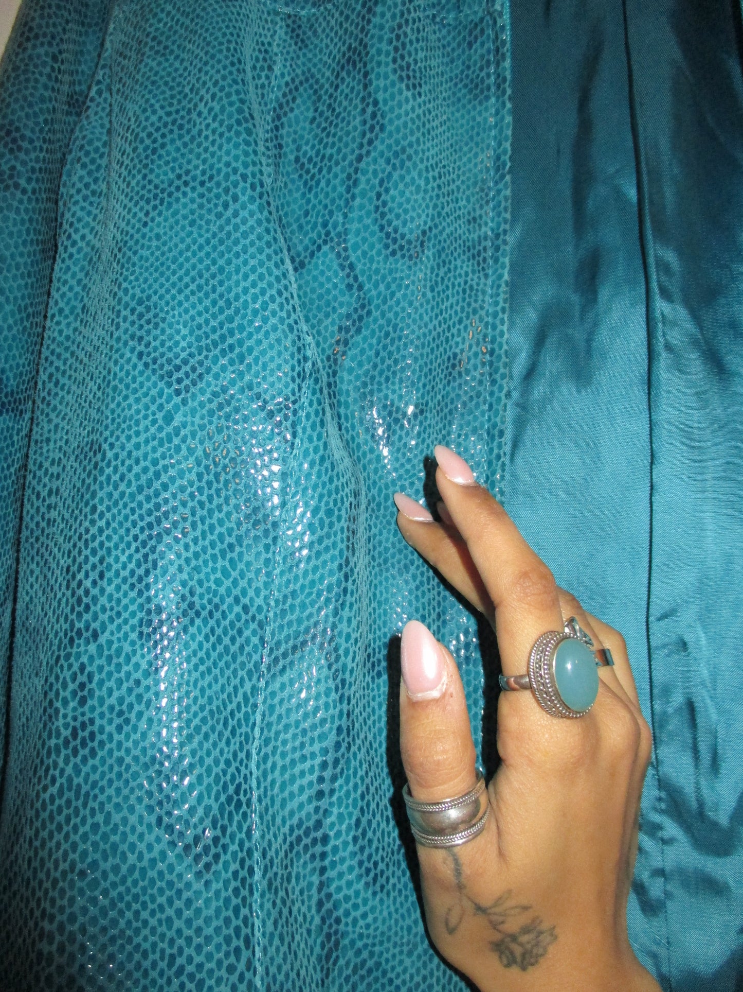 TURQUOISE JACKET WITH A GLOSSY SNAKE EFFECT